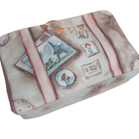 A suitcase with a hand-painted pattern