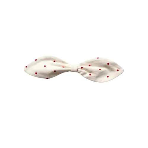 A pink polka dot pattern headband